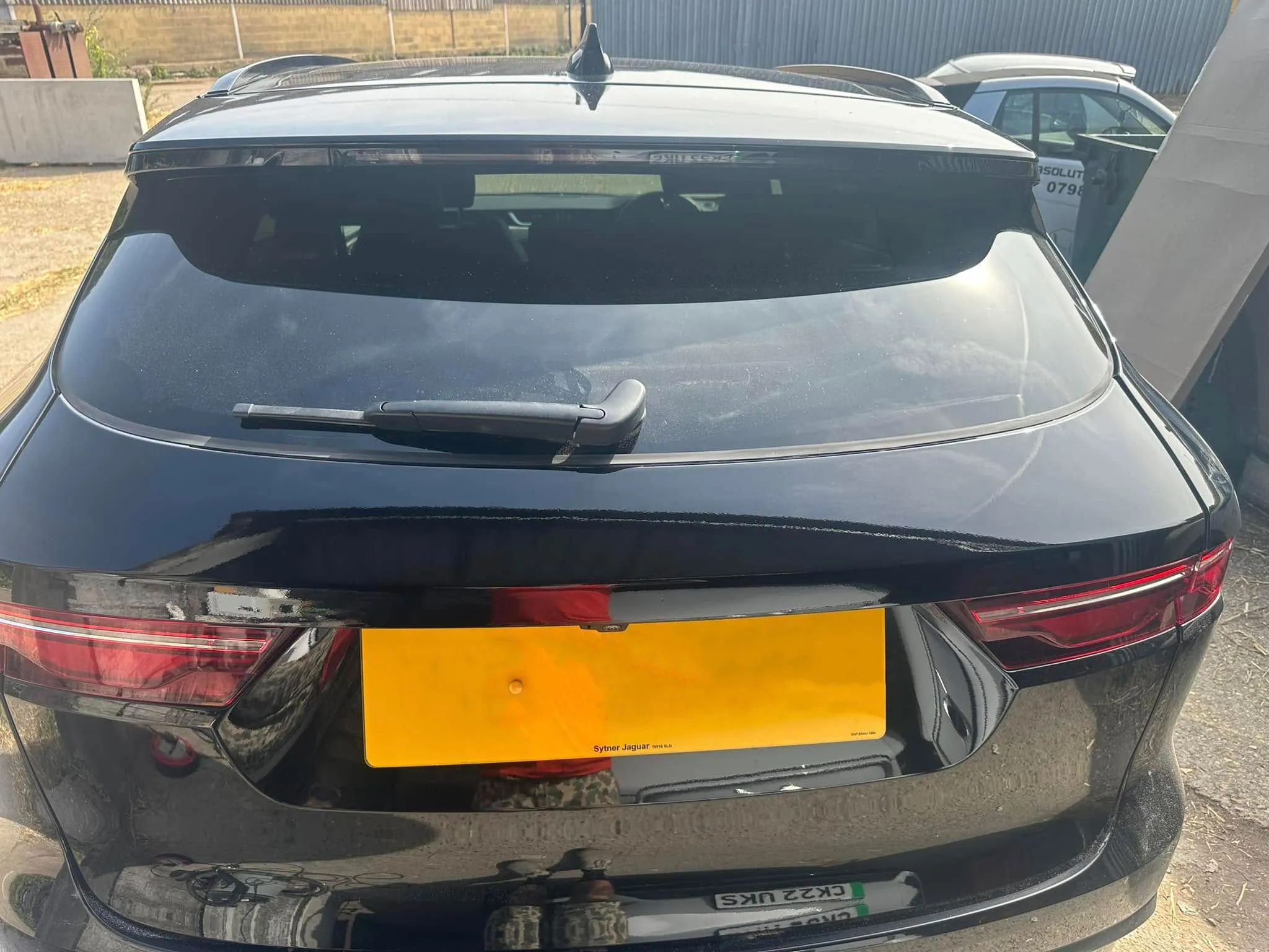 A rear view of a black car